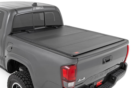 Rough Country (49420500) Hard Tri-Fold Flip Up Bed Cover | 5' Bed | Toyota Tacoma 2WD/4WD (2016-2023)