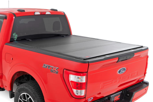 Rough Country (49220550) Hard Tri-Fold Flip Up Bed Cover | 5'7" Bed | Ford F-150 2WD/4WD (2015-2020)