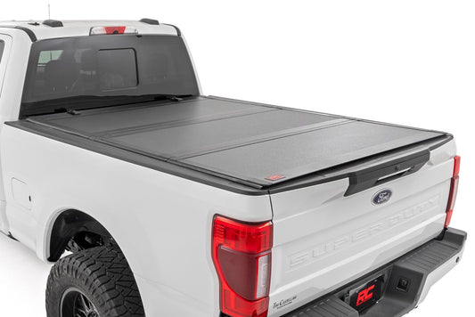 Rough Country (49220651) Hard Tri-Fold Flip Up Bed Cover | 6'10" Bed | Ford F-250/F-350 Super Duty (17-24)